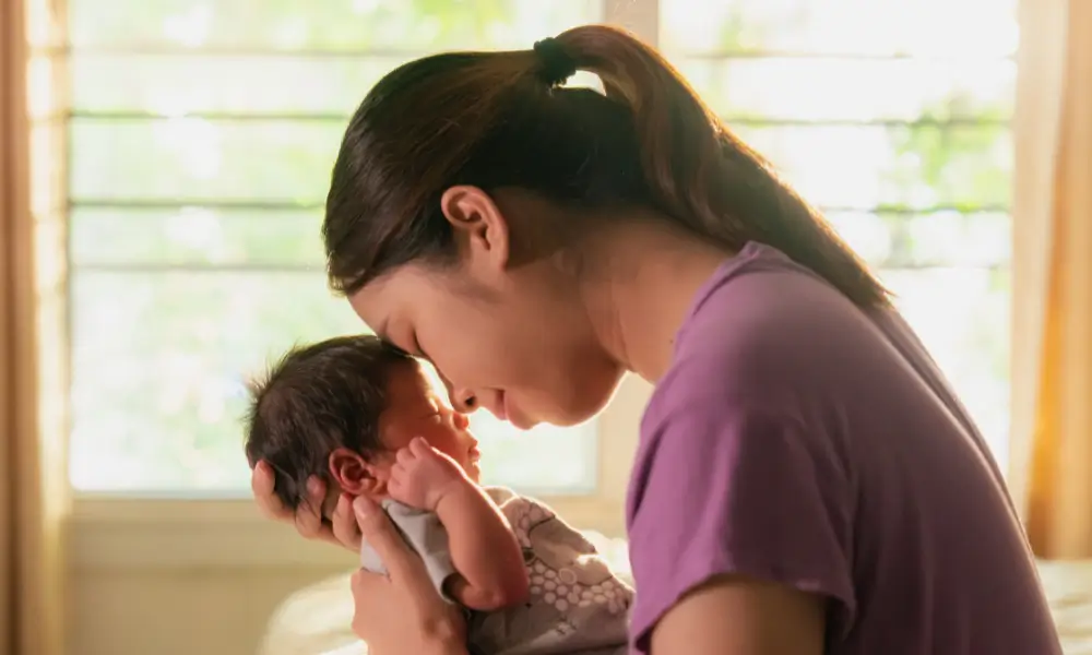 asian mother with newborn child postpartum depression how froglily gives back